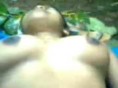 Webcam footage of a curvy black rural playgirl having sex outside